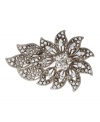 Flower power. Monet's dramatic flower brooch will make a striking statement whenever you wear it! Crafted in silver tone mixed metal, it's embellished with sparkling crystal accents. Item comes packaged in a gift box.