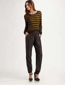 Shimmering silk style with a comfortable elastic waistband and flared pant legs. Elastic waistbandSlash pocketsSilkDry cleanImported