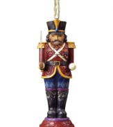 Standing guard at your tree, the Nutcracker soldier ornament is an instant holiday classic. Elaborate carved and patterned detail give him the traditional charm of Jim Shore.