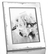 The stylized florals of Modern Love branch out on this gleaming silver-plated picture frame by Monique Lhuillier for Royal Doulton. A timeless balance of refinement and whimsy keeps memories fresh.