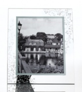Keep memories fresh. Etched with cascading florals, the glass Trousseau picture frame from Martha Stewart Collection gives special moments a romantic sensibility.