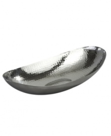 Minimalism at its best. With a hammered interior and simply elegant oval shape, this stainless steel bowl from Leeber's collection of serveware and serving dishes is a beautiful accent on its own and the perfect home for fruit or flowers. Minimalism at its best. With a hammered interior and simply elegant oval shape, this stainless steel bowl from Leeber's collection of serveware and serving dishes is a beautiful accent on its own and the perfect home for fruit or flowers.