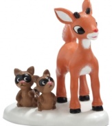 All kinds of cute. Totally smitten, Rudolph reddens as he smiles back a deer friend in this porcelain figurine from North Pole Village, by Department 56.