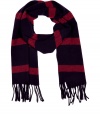 Quietly elegant and effortlessly cool, Jil Sanders dark blue and red wool scarf ups the ante on preppy chic - Supremely soft, lighter weight knit in a rich, classically cool stripe -  Decorative fringe trim at hem - Moderately long and wide and ultra-versatile - Pair with everything from cashmere pullovers and jeans to leather jackets and dress trousers