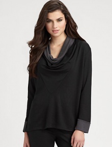 A softly draped cowlneck tops this two-tone jersey silhouette in classic neutral tones. Draped cowlneckLong sleevesDropped shouldersContrast cuffsAbout 26 from shoulder to hemAcrylic/tencel/nylonDry cleanImported