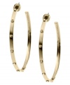 Bring some edge to a timeless look. Michael Kors added stud detail to a classic metal hoop earring. Crafted in gold tone mixed metal. Approximate diameter: 2 inches.