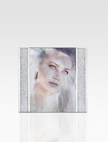 Thousands of shimmering chatons glitter in the columns of this festive picture frame with silvertone metal details. Accommodates a 5 X 7 photograph Overall: 7 X 7½ Made in Austria Thousands of shimmering chatons glitter in the columns of this festive picture frame with silvertone metal details. Accommodates a 5 X 7 photograph Overall: 7 X 7½ Made in Austria