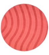 Abstract and absorbing, this rose-colored rug adds movement to any room. Playful, wavy lines reverberate against a warm red ground, resounding with personality in your home.