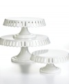 Dessert just got sweeter. A pierced edge lends feminine frills to this already-graceful white porcelain cake stand from Martha Stewart Collection.