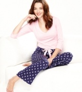 Take a cue from the season of gift giving and tie yourself up in these soft cotton pajamas by Nautica. Plaid  pants feature a satin ribbon drawstring. Comes conveniently wrapped for easy gift-giving.