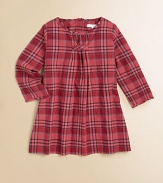 A classic check frock, delicately updated with a gathered neckline and pleated bodice.Round, gathered necklineLong sleevesBack buttons94% cotton/5% polyamide/1% elastaneDry cleanImported Please note: Number of buttons may vary depending on size ordered. 