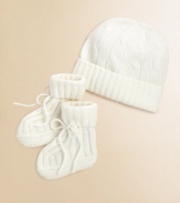 Adorable baby's hat and bootie set knit in luxurious, ultra-soft cashmere. Hat Ribbed, foldover brimCinched top Booties Foldover ankle cuff with tie closureCashmereDry cleanImported