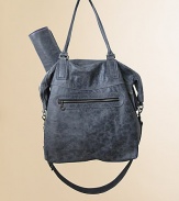 A perfect little carryall for life on the go with baby, in stylishly distressed leather in slouchy silhouette with top zip closure, detachable shoulder strap, stroller clips, matching changing pad and plenty of convenient pockets.Double top handles, 9.5 dropTop zip closureDetachable