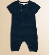 A classic one-piece crafted in luxe, knit cashmere with front and bottom button closure.CrewneckShort sleevesButton-frontBottom buttonsCashmereMachine washImported Please note: Number of buttons may vary depending on size ordered. 