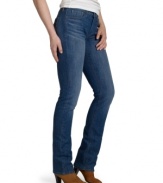 Levi's petite straight-leg jeans feature a flattering fit enhanced by a fashionable wash and a slimming, smoothing fabric panel at the interior.