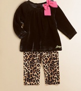 A plush velour tunic is adorned with a standout bow and Juicy signature and paired with cheetah-printed leggings for a wild ensemble.Round neckline with bowLong sleevesBack buttonsGathered bodicelLogo on hemElastic waistbandAnkle button detailCotton/SpandexMachine washImported Please note: Number of buttons may vary depending on size ordered. 
