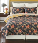 Beauty in bloom. Create a relaxing retreat in your space with this Evening Garden quilt from Martha Stewart Collection, featuring a luxurious landscape of delicate buds on a deep, rich backdrop. Flip the quilt for a bright yellow stripe pattern.
