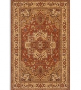 Intricately designed in the classic Serapi-style of Persia with a striking center medallion, this rug is painstakingly crafted to capture the abrash or stria effect often associate with aged vegetable dyes. After weaving, each rug is given a special antique wash to further harmonize the colors with a rich vintage patina.