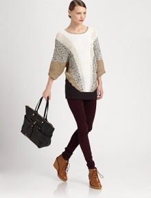 Shot through with shimmering metallic threads, this lengthy, textural sweater has voluminous dolman sleeves and a colorblocked pattern. ScoopneckDropped shouldersThree-quarter dolman sleevesRibbed cuffs and hem70% cotton/30% linenDry cleanImportedModel shown is 5'10 (177cm) wearing US size Small.