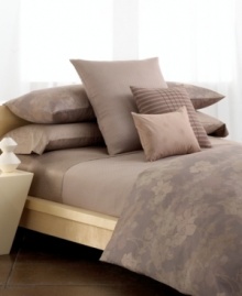 Suite sophistication. Calvin Klein's Magnolia duvet cover set recalls the beauty of outdoor gardens with an overlapping print of delicate blossoms in subtle tones of rosehip, cardamon and sable. Reverses to self. (Clearance) Suite sophistication. Calvin Klein's Magnolia duvet cover set recalls the beauty of outdoor gardens with an overlapping print of delicate blossoms in subtle tones of rosehip, cardamon and sable. Reverses to self. (Clearance)