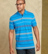Classic preppy style is a can't-miss when you are wearing this striped polo from Tommy Hilfiger.