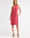 An elegant sheath finished crisp front pleating and an interwoven belt.Jewel necklineSleevelessFront pleatsBelt detailBack princess seamsCenter back zipperAbout 21 from natural waistPolyesterDry cleanImported