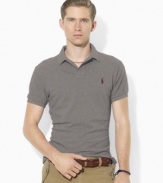 Designed in a trim modern fit with higher armholes, a slimmer cut and a shorter hem, this short-sleeved polo shirt is rendered in breathable cotton mesh for iconic style.