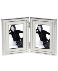 Add new elegance to beautiful memories with Vera Wang's With Love Blanc folding picture frame. Geometric detail lends metallic shimmer to creamy white enamel in a home accent that invokes modern and deco design. Add new elegance to beautiful memories with Vera Wang's With Love Blanc folding picture frame. Geometric detail lends metallic shimmer to creamy white enamel in a home accent that invokes modern and deco design.