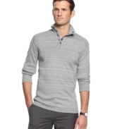 To mock is to envy. This long-sleeved shirt with mock neck collar from Calvin Klein is a polished layer for the season.