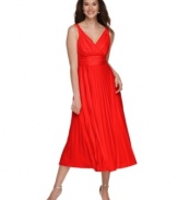A beautiful drape and delicate pleating lend simple elegance to this Grecian-inspired evening dress by Suzi Chin.