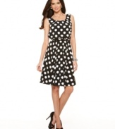 Distressed, printed circles create anything but your ordinary polka-dot! Gorgeously shaped in an A-line silhouette, this dress was made for both work and play.