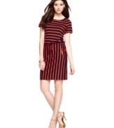 Calvin Kleins put a fresh spin on stripes, outfitting this petite dress with horizontal bands at the bodice and vertical through the skirt. The look is tied together with a drawstring waist and sleek zippered pockets.