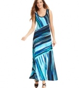 Calvin Klein's printed maxi dress is radiant with a striking stripe motif and relaxed fit.