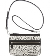 Twice as nice. The nylon crossbody purse by Calvin Klein transforms into a sleek modern clutch.