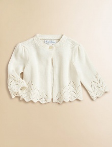 A comfortable knit shrug is crafted in a delicate pointelle cotton, making it perfect for both casual and festive occasions.CrewneckLong sleevesSingle-button closureScalloped pointelle-knit hemCottonHand washImported Please note: number of buttons may vary depending on size ordered. 