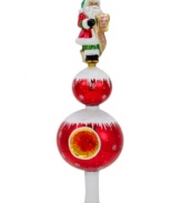 The new star of your tree, the Wishful Thinking finial from Christopher Radko is a balancing act featuring Santa atop two ball ornaments. A bright red hue and classic reflector add to its brilliance.