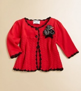 This charming, extra layer of knit warmth, features dainty rosettes and scalloped trim in a two-button silhouette.Round necklineLong sleevesButton-frontCottonMachine washImported Please note: Number of buttons may vary depending on size ordered. 
