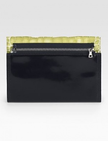 Slip your iPad® into this sleek stylish cover crafted from lustrous leather with a painted croc flap.Top zip closureFully lined10¾W X 8¼H X 1/4DImported