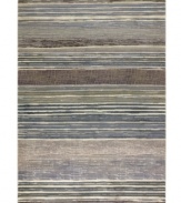 Variegated tones of bone, tan, silver, teal and sage are interwoven across this Taylor Vibrato area rug from Couristan, creating the ultimate floor accent for complementing industrial and mid-century decors. Wilton-woven for unparalleled depth, texture and quality.