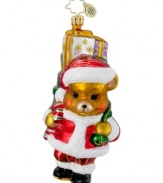 Delivering Santa's presents and dressed in his suit, the A Bear who Cares ornament shows support for pediatric cancer charities in dazzling glass from Christopher Radko.