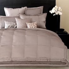 Ottoman Duvets and Shams: Soft and seductive ottoman striped duvet trimmed with a 1.5 silk flange. Silk Quilt: Luxurious 100% silk quilt is accented with a tufted border, reversing to cotton sateen. Tailored Pleat Sheets and Bedskirts: 400 thread count cotton sateen with pleated detail on flat sheet and pillowcase. Fitted sheet has elastic all around to fit most luxury mattresses. Ottoman Duvets and Shams: Soft and seductive ottoman striped duvet trimmed with a 1.5 silk flange. Silk Quilt: Luxurious 100% silk quilt is accented with a tufted border, reversing to cotton sateen. Tailored Pleat Sheets and Bedskirts: 400 thread count cotton sateen with pleated detail on flat sheet and pillowcase. Fitted sheet has elastic all around to fit most luxury mattresses.