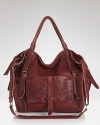 A spacious, slouchy shape lends bohemian-inspired glamor to this tote from Isabella Fiore. Crafted from leather, it's how you do daytime style with a free spirited side.
