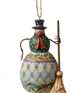 Swept up in a winter wonderland, this frosty snowman ornament features elaborate quilt patterns in cool ice blue, holly green and cardinal red. With the unmistakable folk-art style of Jim Shore.