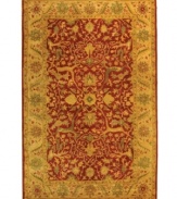 Enjoy a thousand years of rug-making tradition -- set in rich rust tones -- with this meticulously styled area rug from Safavieh. Tufted in India from pure wool, this rug emerges from the annals of antiquity to bring spectacular style and time-honored quality to your home. (Clearance)