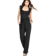 Sugar & Spice updates the jumpsuit with a ruffled halter neck! Rock it with a pair of great heels for a look that's long, lean and timeless.