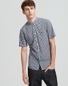Crisp linen and timeless gingham showcase a classic button front shirt from Burberry Brit.