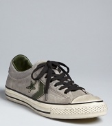 A distressed low-top sneaker that's vintage-inspired and qualitatively cool. From Converse by John Varvatos.