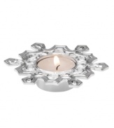 Let it snow! This carved snowflake votive candle holder from Lenox offers a charming way to decorate any home for the holidays. Qualifies for Rebate