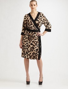 Unleash your wild side in this statement making wrap style with bold contrast trim. V-neck Three quarter sleeves Tie waist Contrast trim Softly pleated About 22 from natural waist 48% rayon/42% polyester/10% spandex Dry clean Made in the USA from imported fabric Unleash your wild side in this statement making wrap style with bold contrast trim. V-neck Three quarter sleeves Tie waist Contrast trim Softly pleated About 22 from natural waist 48% rayon/42% polyester/10% spandex Dry clean Made in the USA from imported fabric