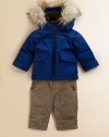 Warmth comes from everywhere - the down fill, the cozy cotton sherpa-like lining in the hood and the fluffy faux fur trim.Attached hood with plush sherpa lining and removable faux fur trimFront zip closeButton cuffsTwo front flap pocketsElasticized bottomNylon liningCotton; down fillDry cleanImported